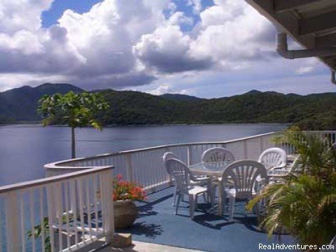 Dining deck | Romantic waterfront villa, private snorkeling beac | Image #17/20 | 