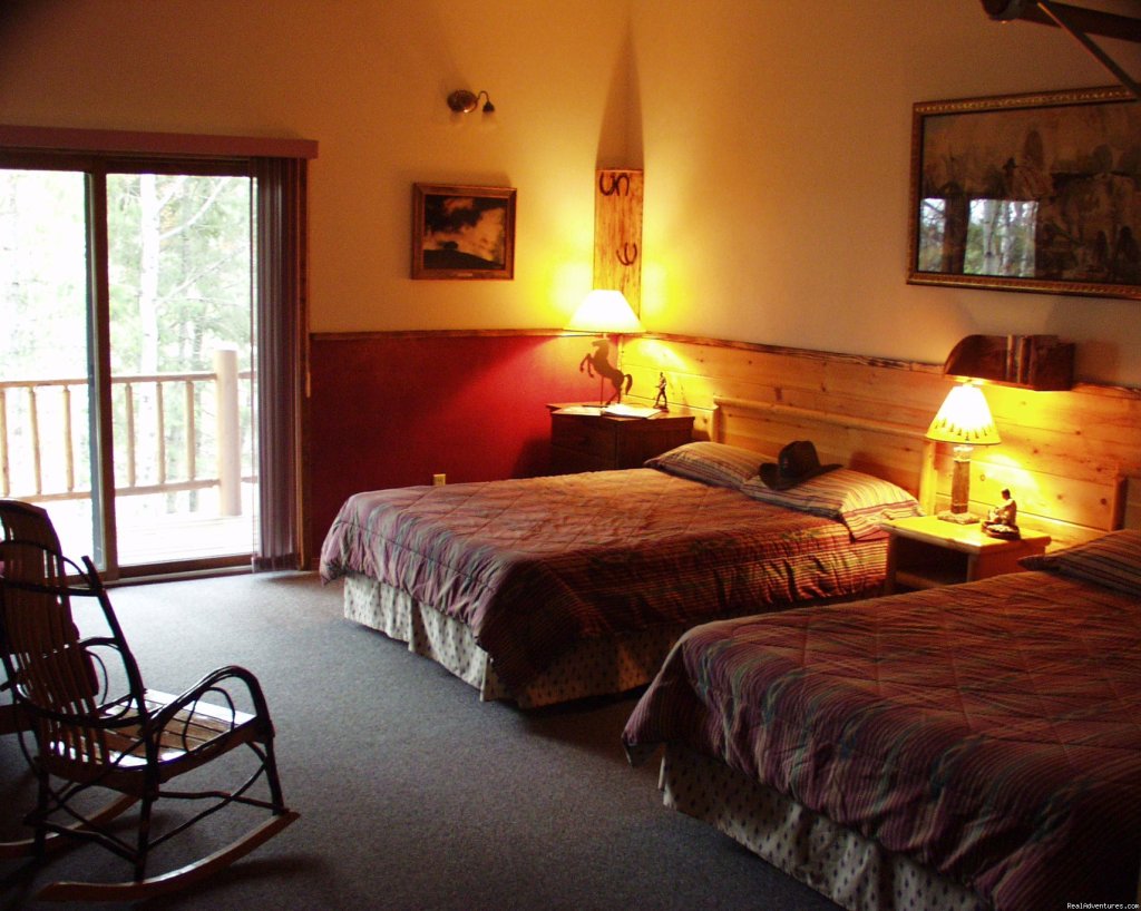 Clean, comfortable rooms w/ western decor | Discover The Rich Ranch Outfitting And Guest Ranch | Image #5/14 | 