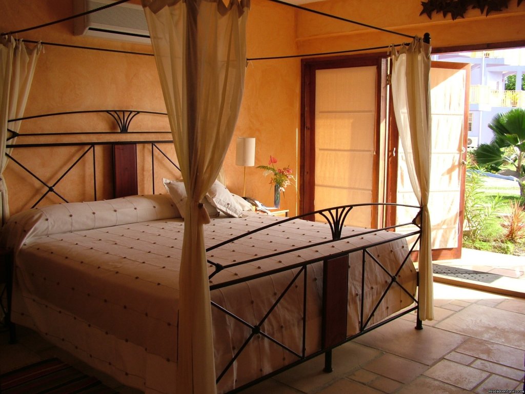 Villa Master Bedroom | Caribbean adventure starts at True Blue Bay Resort | Image #4/22 | 