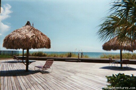 Deck with Tiki Huts | Sandcastle Apartments | Image #3/4 | 