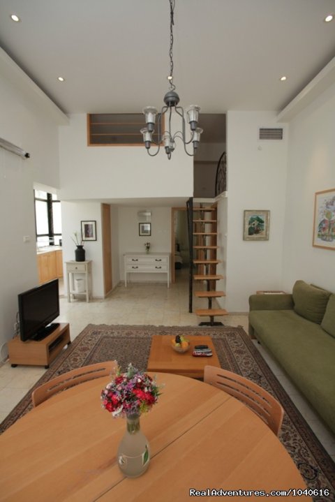 View of the bedroom and sleeping loft from the lounge