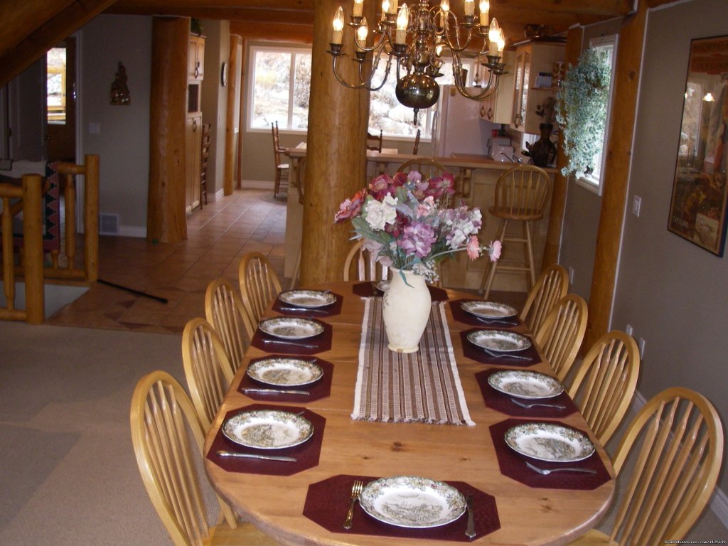 Formal dining area in great room boasting  spectacular views | Sun Peaks Resort Private Post &Beam Chalet | Image #13/23 | 