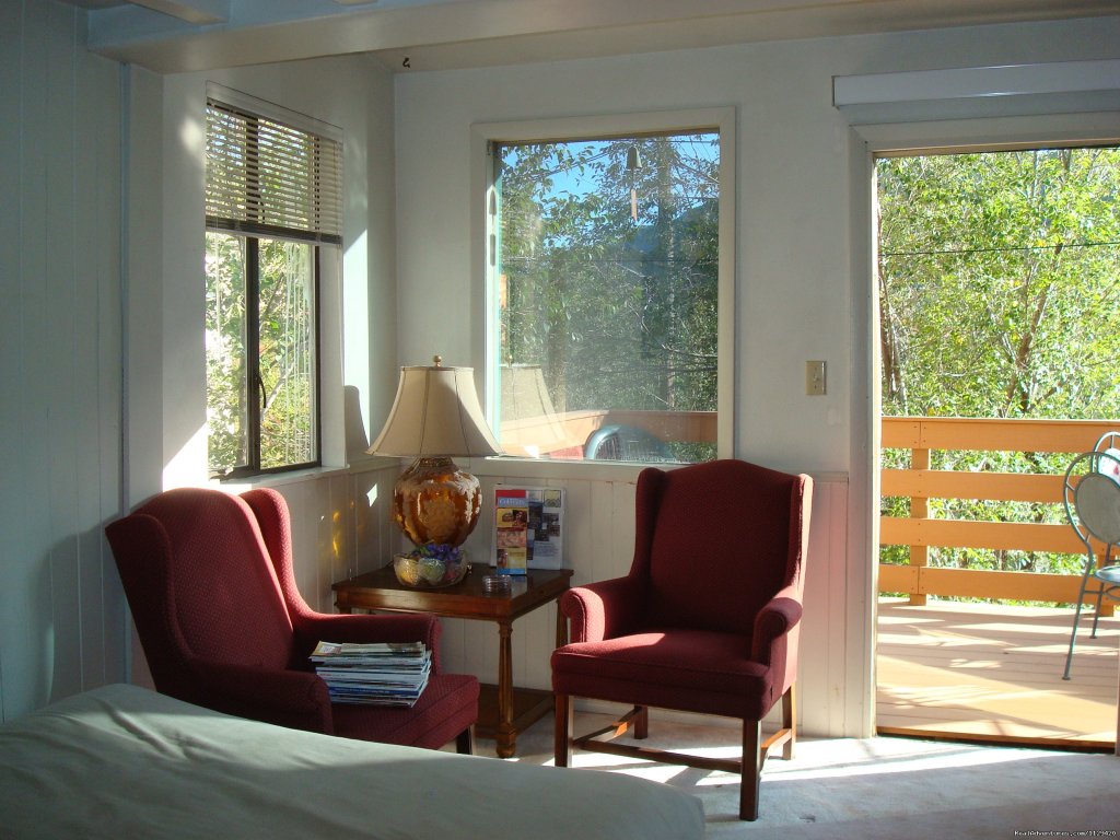LIVING ROOM HAS ACCESS TO THE DECK | Pikes Peak Cabin  By Garden Of The Gods | Image #7/22 | 