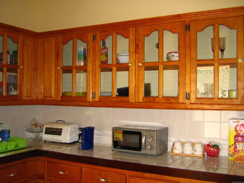 Kitchen area with cupboard and counter top | Rich View Hotel | Image #5/9 | 