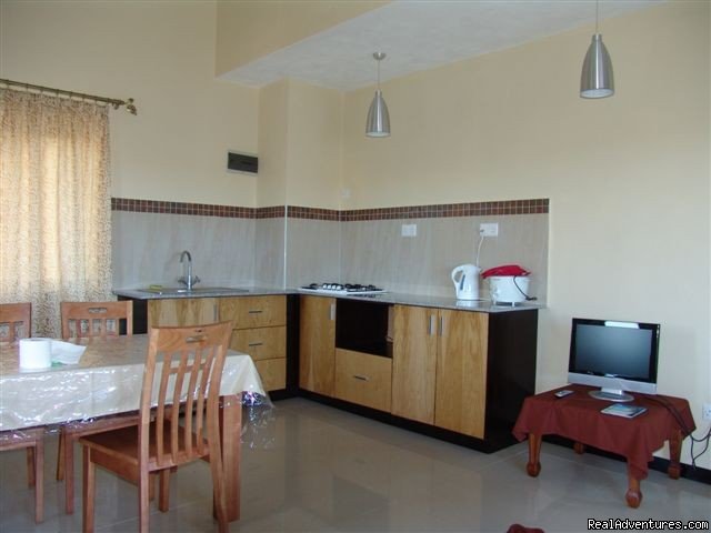 Villa Narmada Living room+kitchen 2 BD apt | Selfcatering luxuous hotelrooms near the beach  | Image #8/10 | 