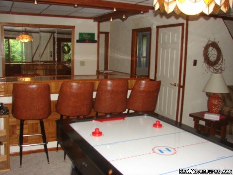game room with wet bar and air hockey table | Charming Chalet with HUGE Deck | Image #4/21 | 