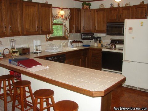 fully stocked kitchen | Charming Chalet with HUGE Deck | Image #8/21 | 