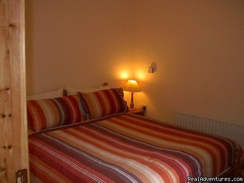 Comfortable bedroom | East Cork Traditional Cottage | Image #4/6 | 