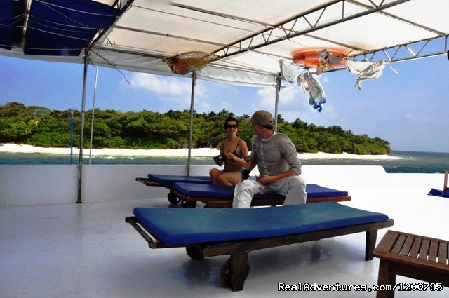 Half shade sundeck of  Liveaboard Dolphin -1 | Maldives Trips - Fishing, Surfing, & Scuba Diving | Image #12/19 | 