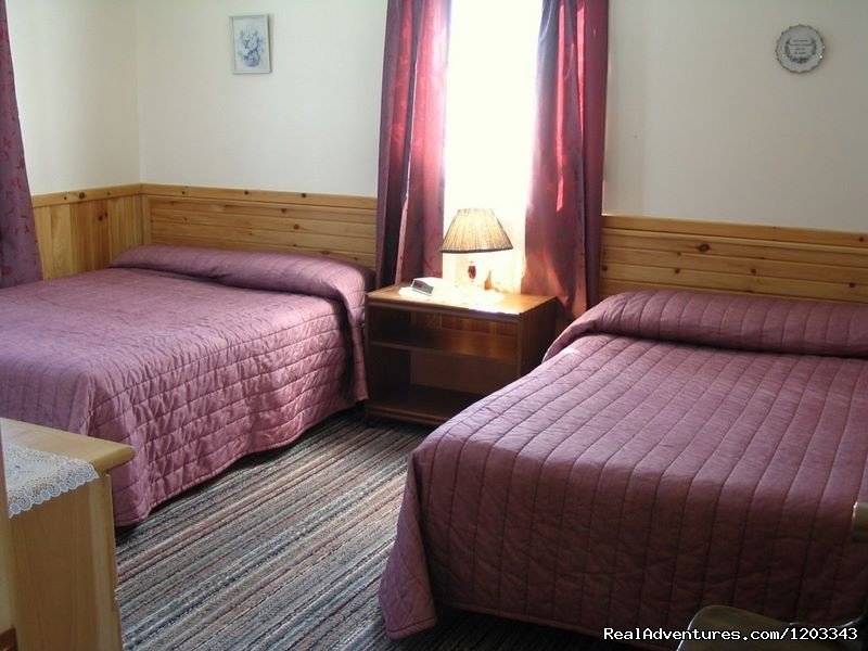 Bedroom in two bedroom cottage. | Orchard View Farm Tourist Home & Cottages | Image #3/6 | 