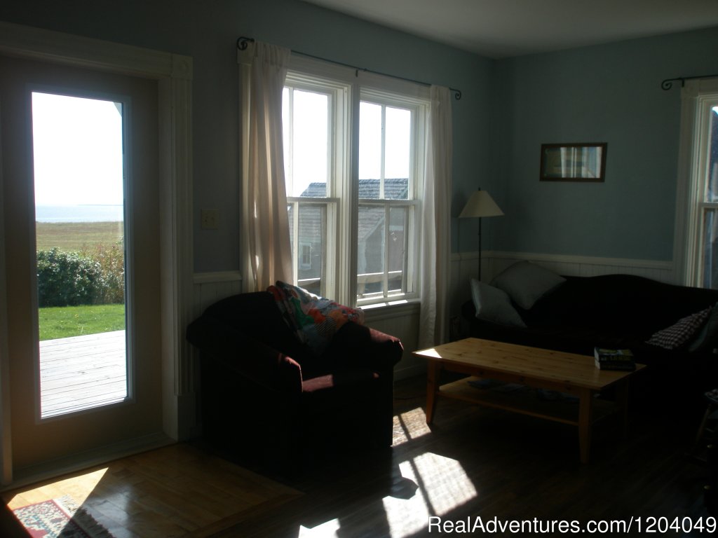 Seating area beside the open kitchen. | South Shore Farm | Guernsey Cove, Prince Edward Island  | Vacation Rentals | Image #1/5 | 