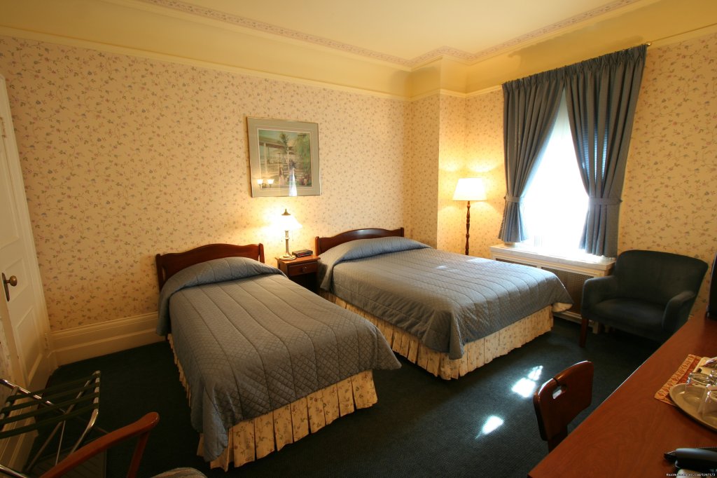 Queen bed with single bed with  garden view | Old Quebec elegant small hotel | Image #4/6 | 