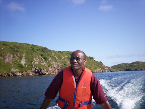 Reverend wilson operating the rowboat.