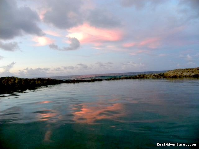 Pink clouds reflected in the natural coral swimming pool | SeaViewPlay  New Pool & Fabulous Ocean Front Villa | Image #26/26 | 