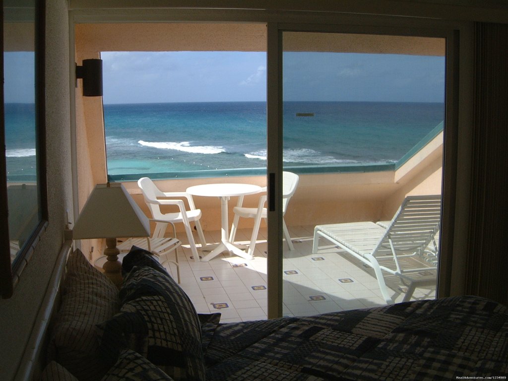 Master Bedroom and Balcony | Ocean's Edge - Great Oceanfront Views, 2 Levels | Image #2/26 | 