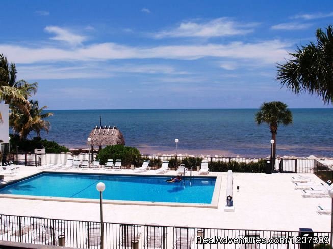 View of the pool and beach from balcony | Royal Plum Club | Image #7/9 | 