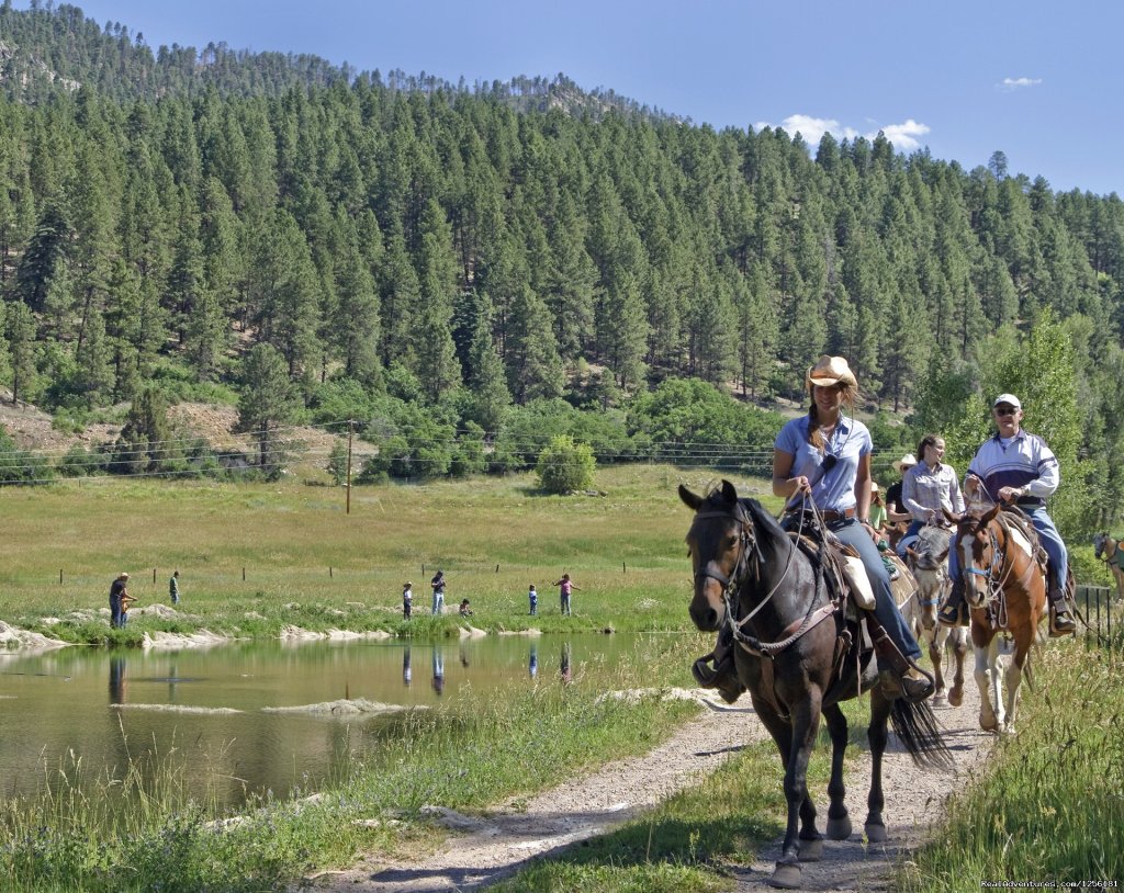 Adults on a lunch ride and kids fishing in one of our ponds | Colorado Trails Ranch, Colorado's Friendliest | Image #6/13 | 