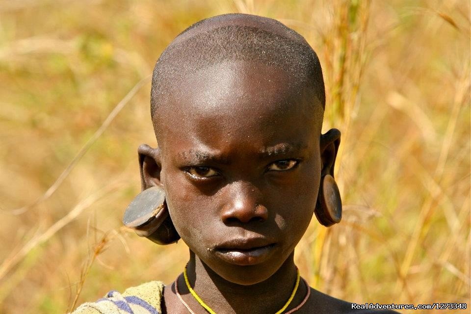 A beautiful child in Surma | Ethiopia Tour and Travel Agent | Image #7/21 | 