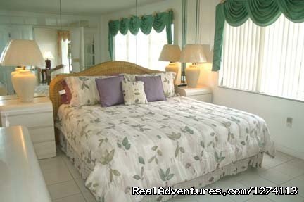 King bed in master with water views | Yacht and Beach Club - Waterfront Condo | Image #7/25 | 