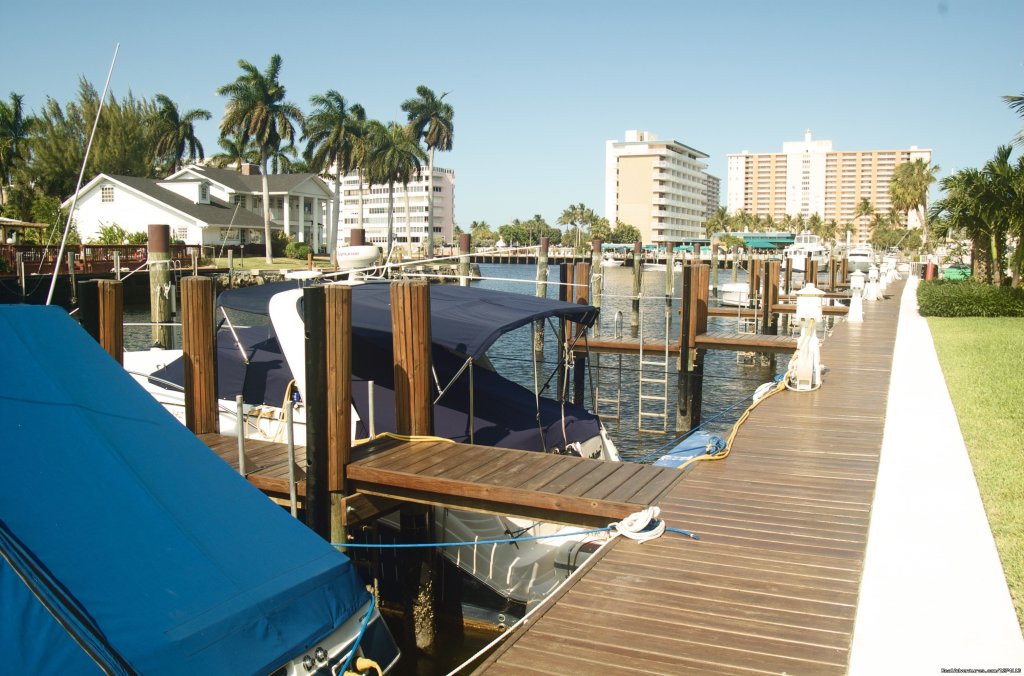 Marina docks along property backyard | Yacht and Beach Club - Waterfront Condo | Image #10/25 | 