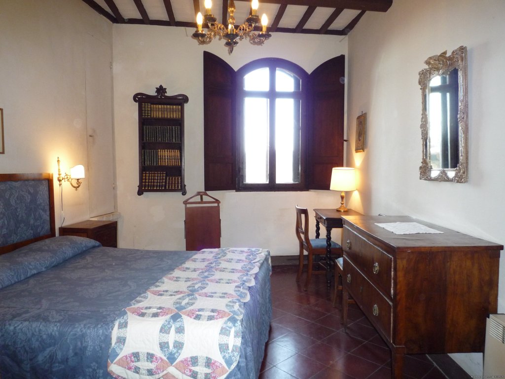 A bedroom in Torre del Vescovo | Live in a castle in breathtaking country | Castelnuovo Berardenga SI, Italy | Hotels & Resorts | Image #1/8 | 