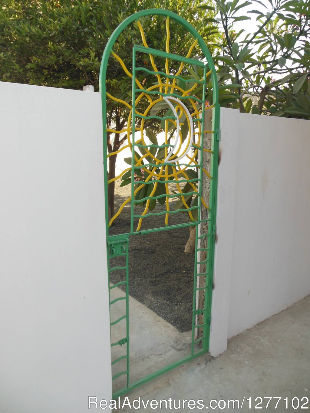 Garden / Courtyard gate with Doggie Door. | Bungalow by the Sea 'No Longer for Rent.' | Image #23/26 | 