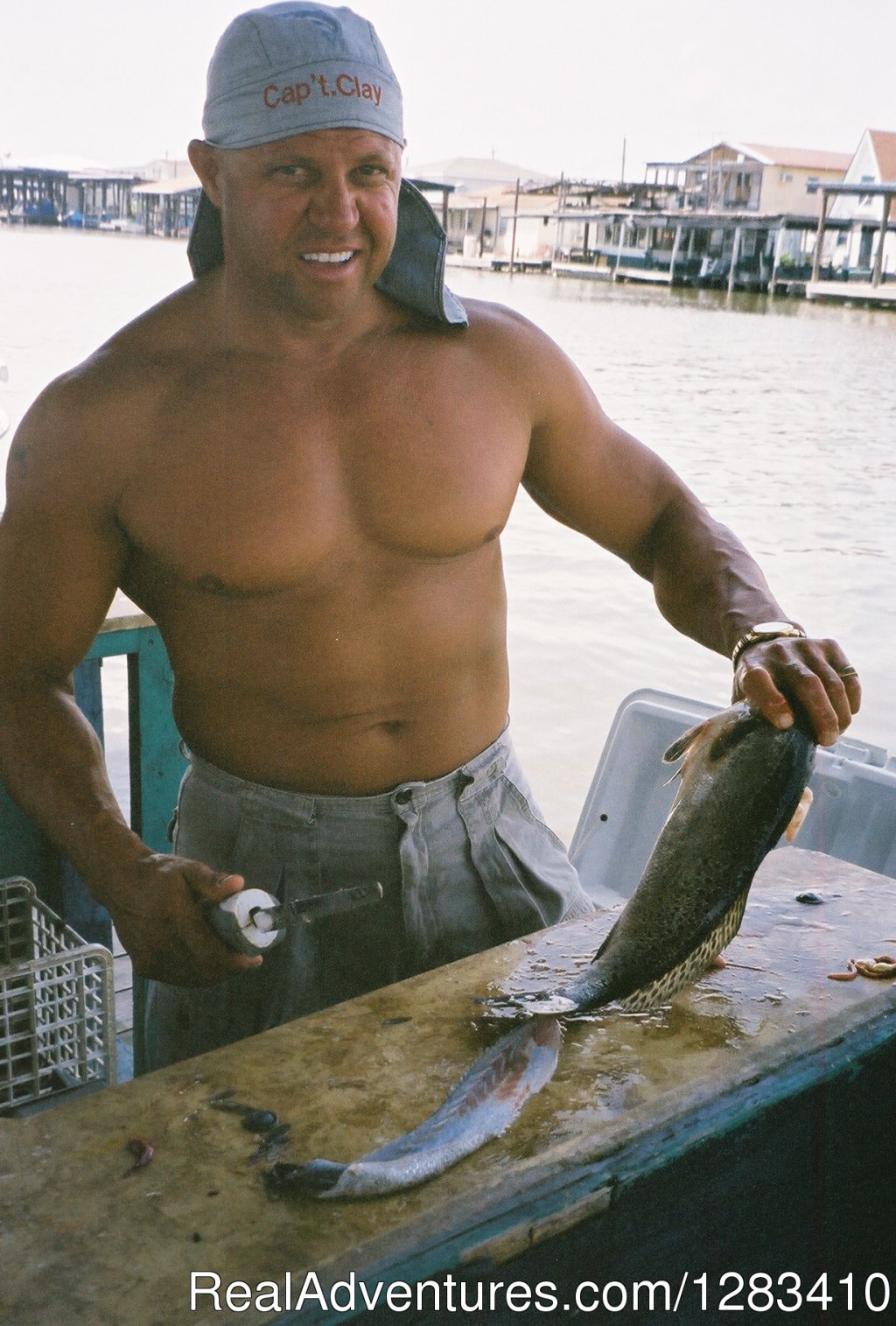 Captain Clay Cleaning The Catch Of The Day | Bayou Log Cabins | Image #8/13 | 