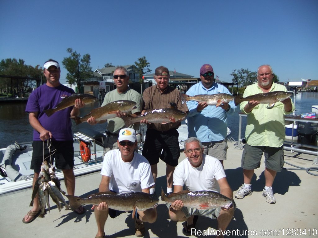 Clients Showing Off Some Nice Red Fish | Bayou Log Cabins | Image #12/13 | 