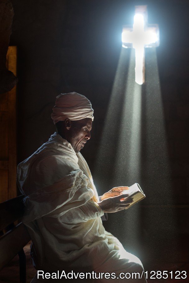 Image of a priest on prayer | Luxury Ethiopia Tours with His-Cul Tour Operator | Image #4/5 | 