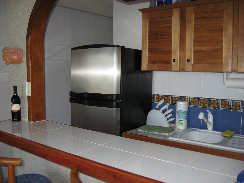 Kitchen/Bar Area | Cancun Area - Ocean Front, Pool Side Condo Rental | Image #2/3 | 