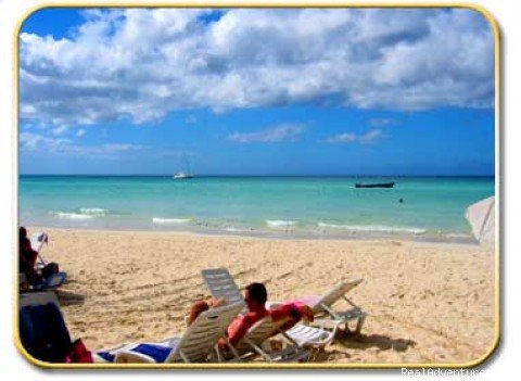 Relaxing on the beach | Rondel Village: A romantic beachfront retreat | Negril, Jamaica | Hotels & Resorts | Image #1/9 | 