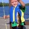 Gunflint Lodge-family vacations in northeast MN Grandson with bass