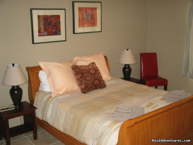 Guest bedroom with sleigh bed | Luxury home with privacy and spectacular views | Image #23/26 | 