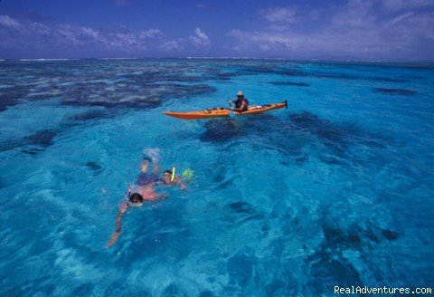 Kayaker and snorkellers