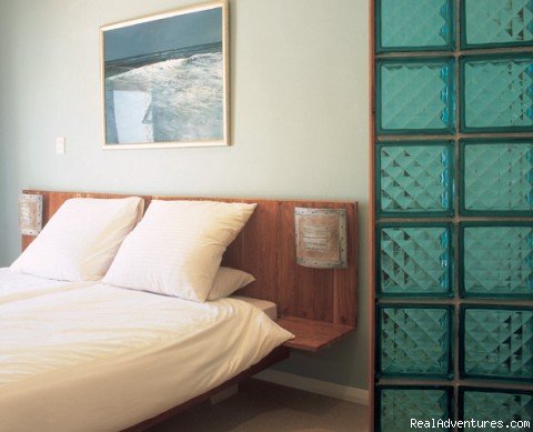 bed & glass wall | Rosedene Lodge | Image #2/4 | 