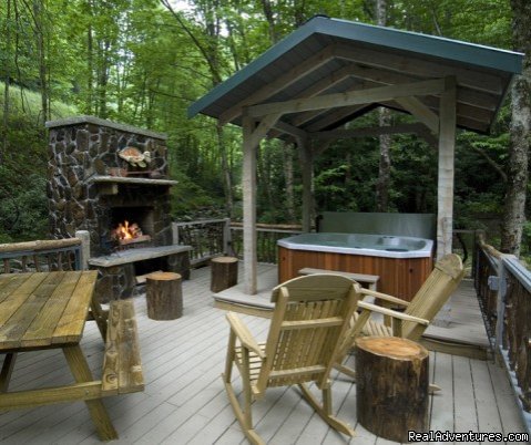 Creekside deck with fireplace and hot tub (Waters Edge) | Creekside luxury log cabins in the Smokies | Image #8/17 | 