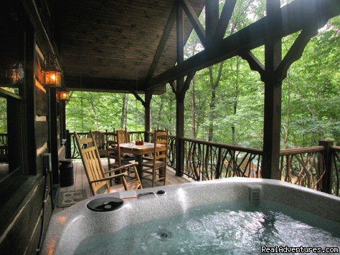 Hot tub on deck with Rhododendron railings (Cherokee Lodge) | Creekside luxury log cabins in the Smokies | Image #14/17 | 