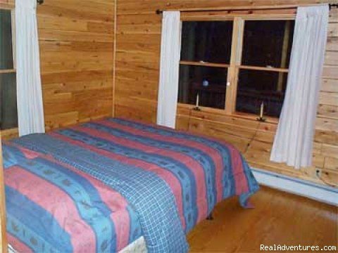 Moose Bedroom | Escape to Maine in a Cozy Log Cabin | Image #5/8 | 