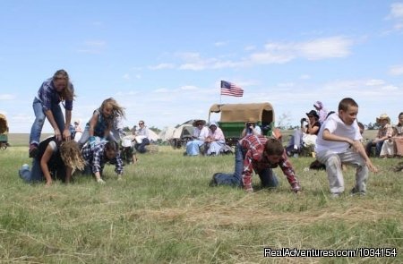 Old fashion family fun like leap frog race | Family Adventure on Genuine Covered Wagon Train | Image #9/13 | 