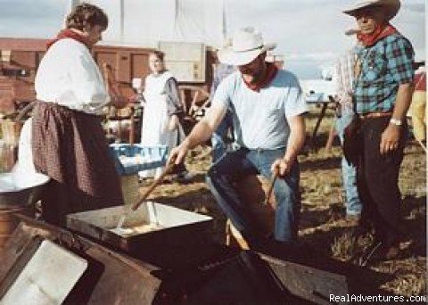 Meal being prepared over firepit | Family Adventure on Genuine Covered Wagon Train | Image #6/13 | 