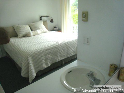 Master king bedroom with sink and vanity | Image #9/13 | Spinnaker Chincoteague Waterfront Vacation House -