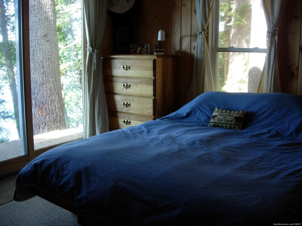 Master bedroom looks right out at the lake | Quiet Waterfront Thompson Lake, ME | Image #9/14 | 
