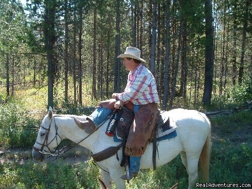 Guide pointing out  historical information | Fantastic Horseback Riding in Yellowstone Country | Image #11/15 | 
