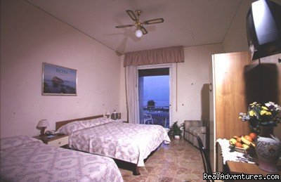 triple room with private bathroom and beautiful terrace | Hostel and Hotel Bella Capri | Image #2/4 | 