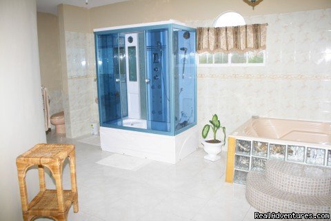 Master bedroom Ensuite bathroom: Double Jacuzzi and shower