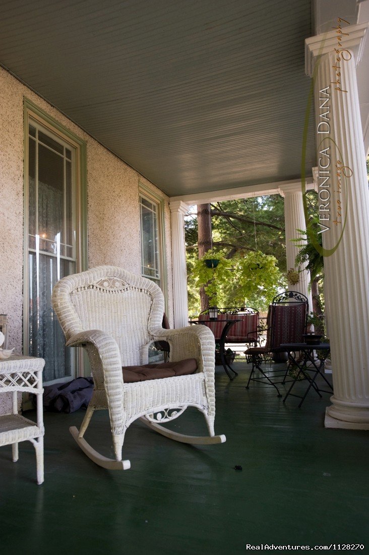 Relax on Wrap-Around Front Porch Under the Magnolias | A Jewel of Comfort & Hospitality - Magnolia House | Image #16/16 | 