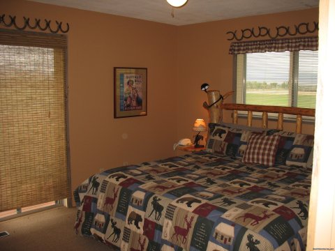 Master Bedroom in Kamloops with ensuite bath | Riverfront Cabins on a Private 1400 acre ranch | Image #7/19 | 
