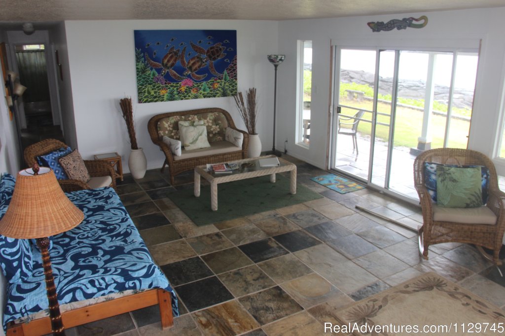 Living room with sliders to oceanfront lanai | Big Island Hawaii Vacation Homes at a Great Price | Image #10/26 | 