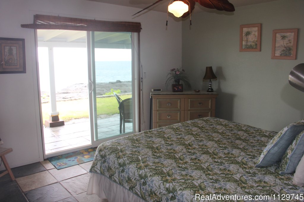 Master bedroom with King bed and sliders to lanai, hot tub | Big Island Hawaii Vacation Homes at a Great Price | Image #13/26 | 