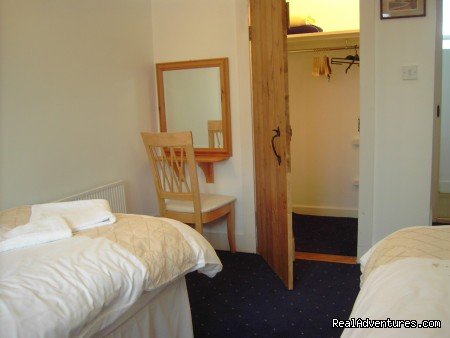 Twin bedroom with walk in wadrobe | Luxury Castleoliver Coach House | Image #10/15 | 